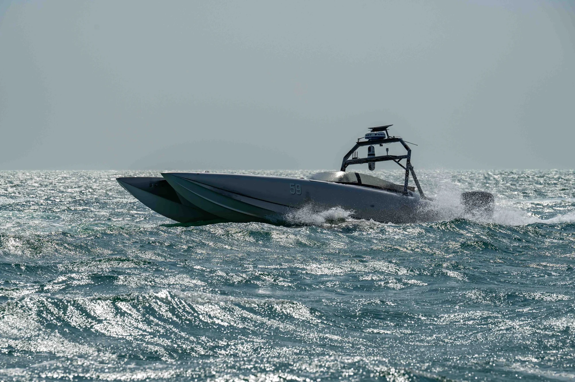 A MARTAC unmanned surface vessel underway, archival U.S. Navy photograph