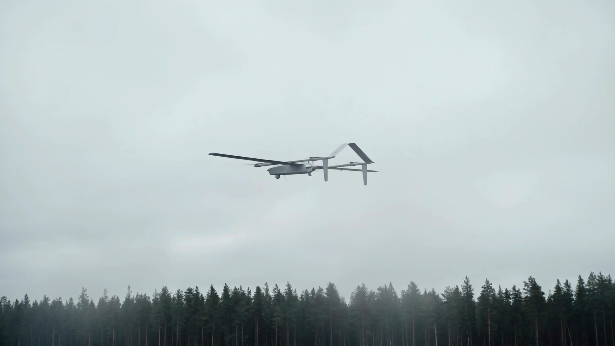 Glacis in flight above a misty forest, design visualisation